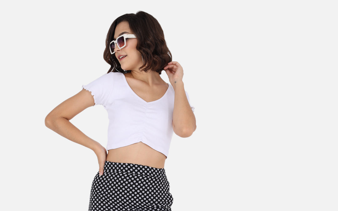 A black polka dot midi skirt — the most wearable way into the print