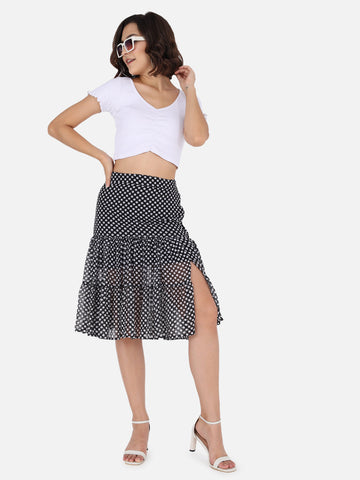 A black polka dot midi skirt — the most wearable way into the print