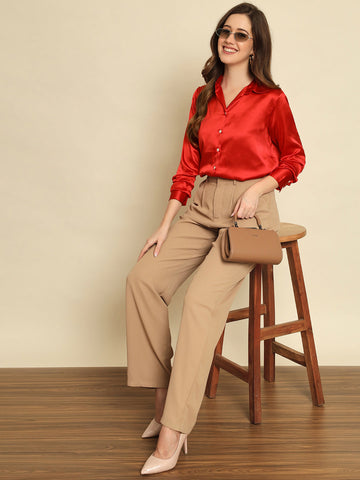 A red satin shirt styled for evening — one of ten red outfit combinations