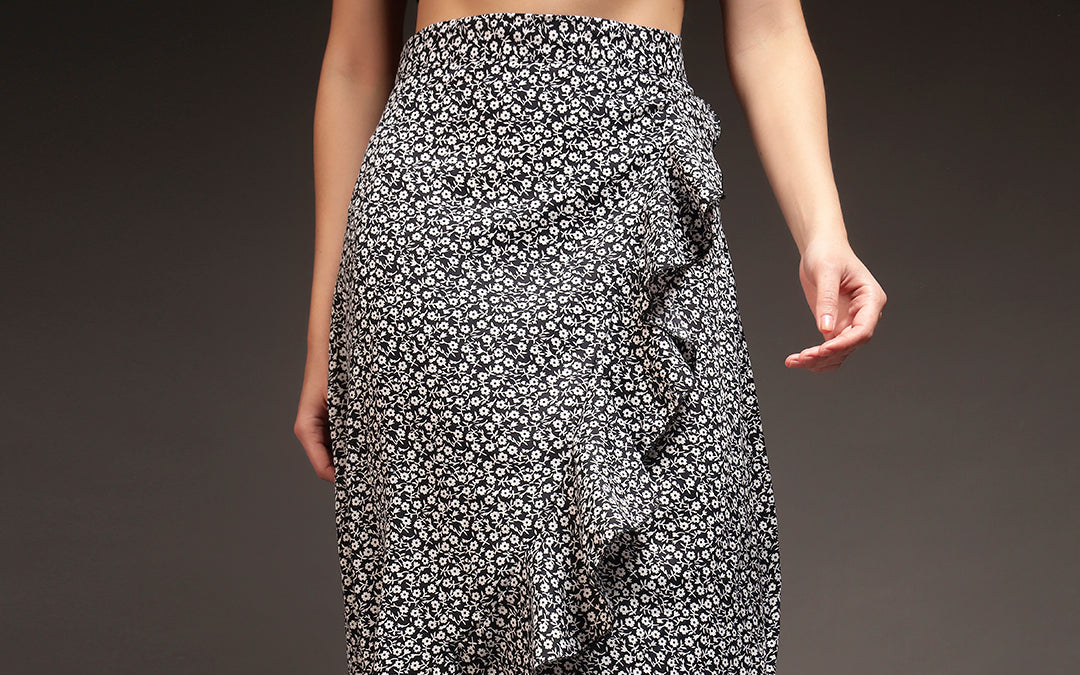 A black wrap-around tie-up midi skirt, the most versatile version of the shape